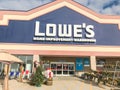 Entrance to LoweÃ¢â¬â¢s hardware store under cloud blue sky